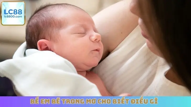 Bế em bé trong mơ cho biết điều gì